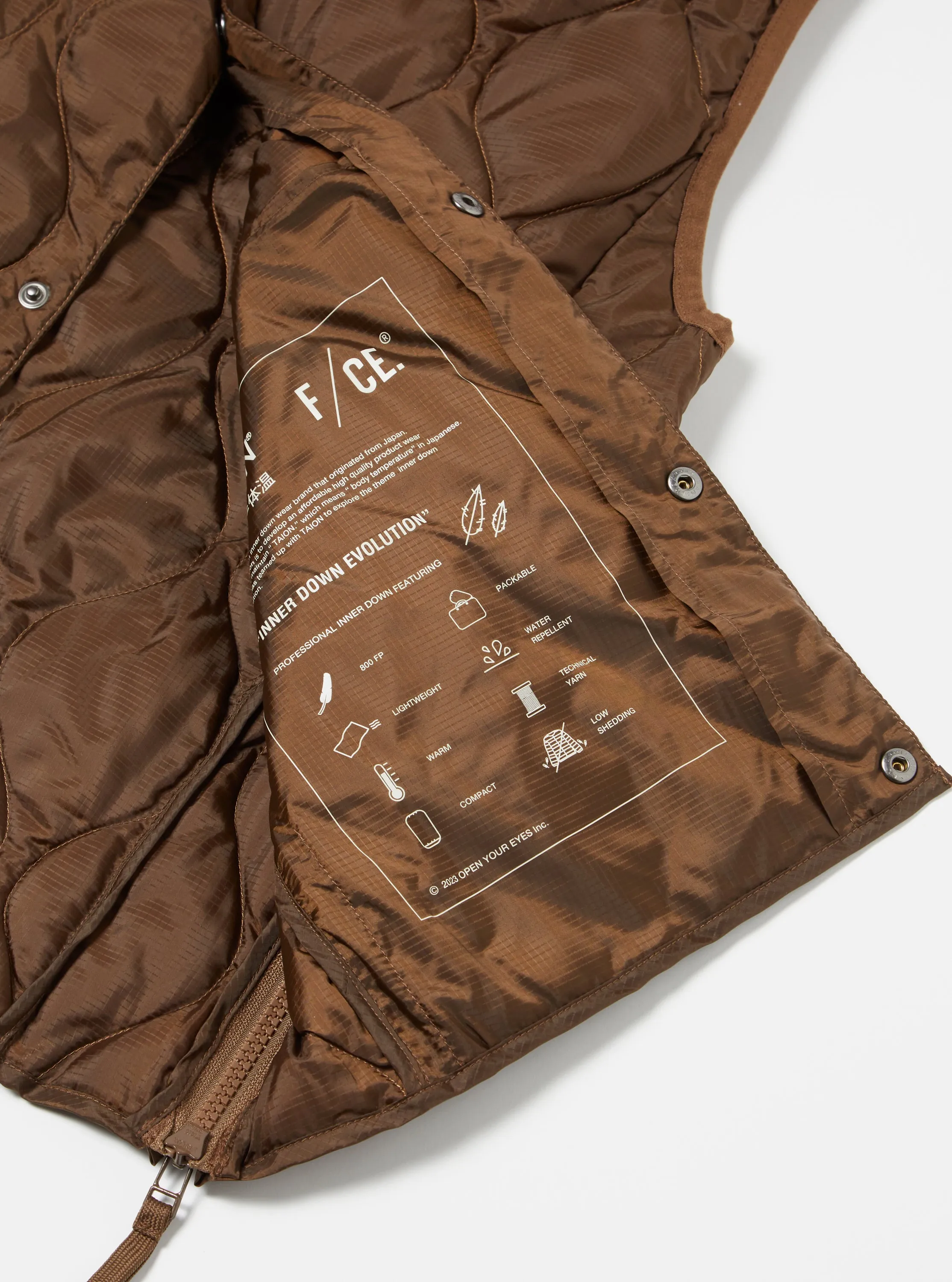 Taion by F/CE. Packable Down Vest in Brown Nylon Ripstop/Duck Down